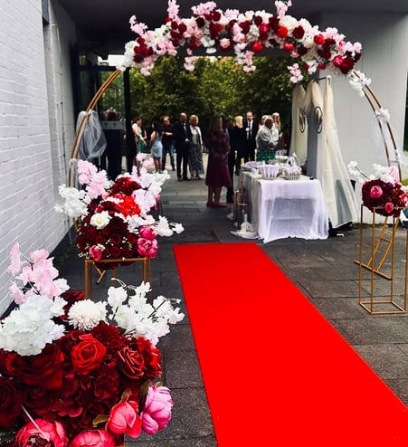 a red carpeted area with a red carpet and a red carpeted area with