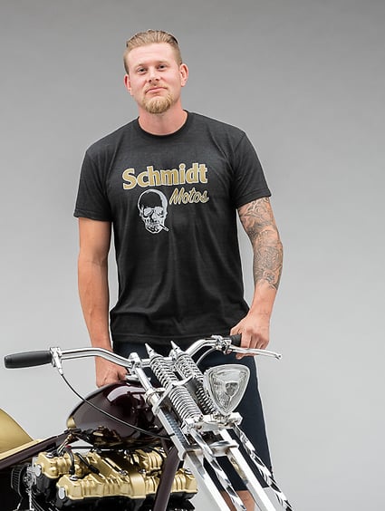 Man standing by motorcycle