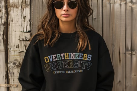 a woman wearing sunglasses and a black sweatshirt with a black and white shirt