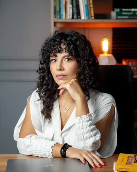 a woman lawyer sitting at a desk with a laptop