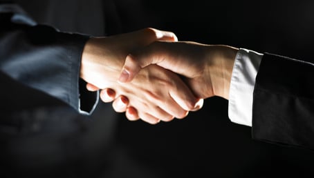 a man and woman shaking hands