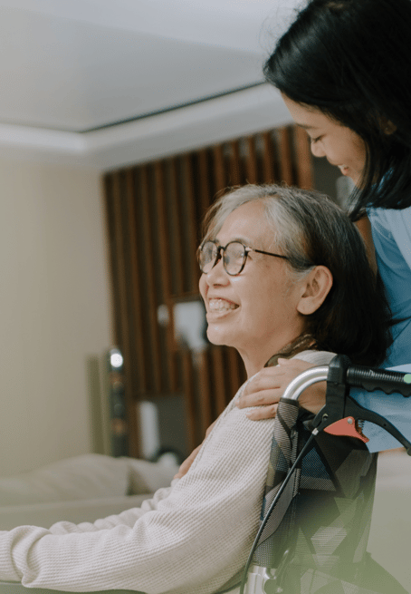 woman in wheelchair, caring for elderly