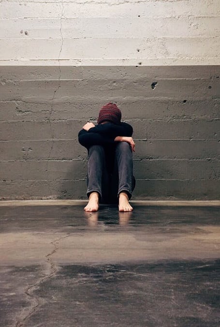 a person sitting on the floor in a room