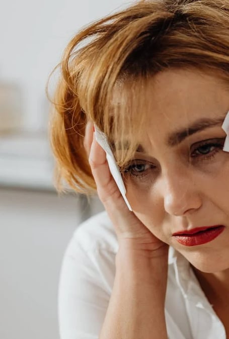 a woman with red lipstick and red lipstick on her phone