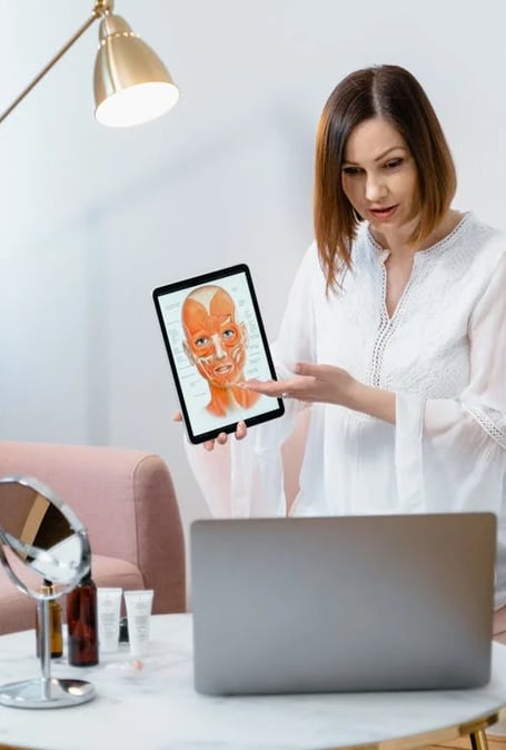 a woman holding a tablet computer and a tablet