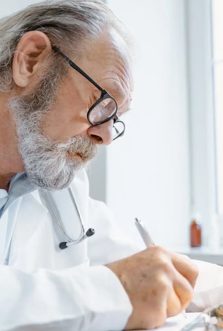 a doctor in a white coat and a stethrobe