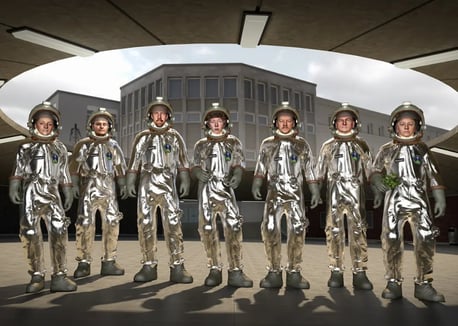 Group shot of Human Studio depicted as a group of astronauts dressed in silver space suits.