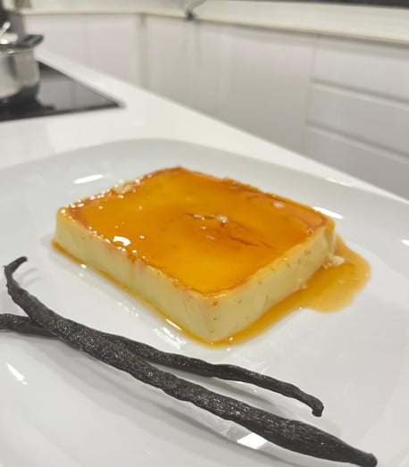 a square piece of cake with vanilla cream and vanilla cream