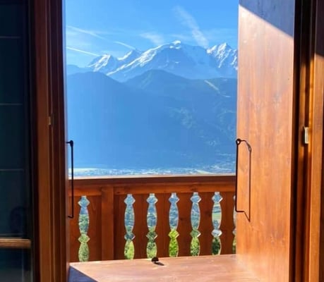 a view of a mountain view from a window