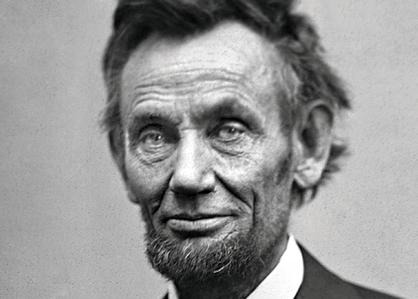 a black and white photo of a man in a suit and tie