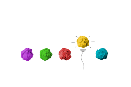 Crumpled colored paper with yellow one raise and made to look like a lightbulb.