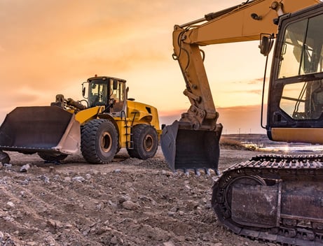 a tractor with a bulldozer and a bulldozer; BUILDWITHAMPRO.COM