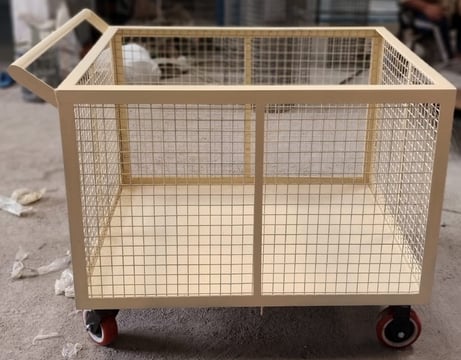 Wire mesh trolley has sheet in downside
