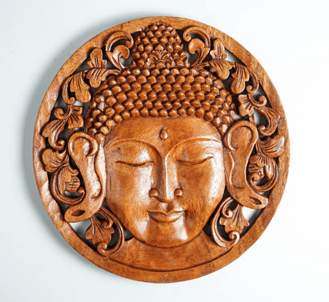 a wooden carving of a buddha statue