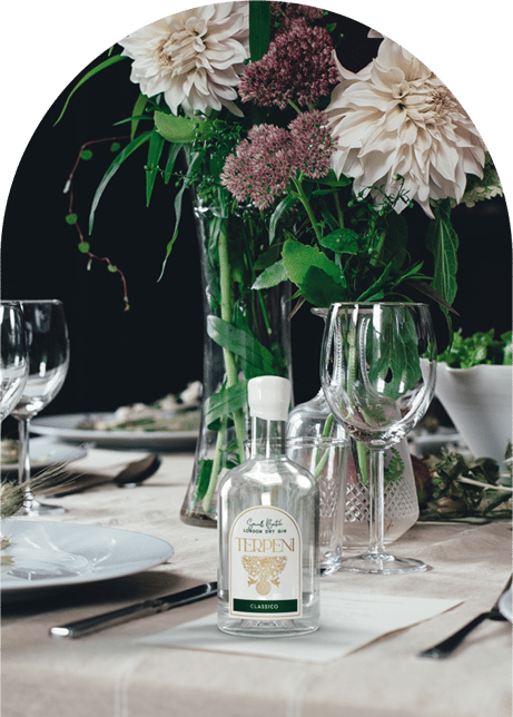 a table setting with a vase of flowers