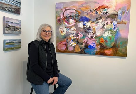 Paulette Melanson in front of her artwork at Gallery on Lincoln (photo credit: Lunenburg Barnacle)