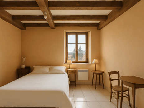 a bedroom with a bed and a table with a table and chairs