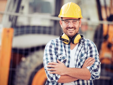 a man in a yellow helmet and a yellow helmet; buildwithampro.com
