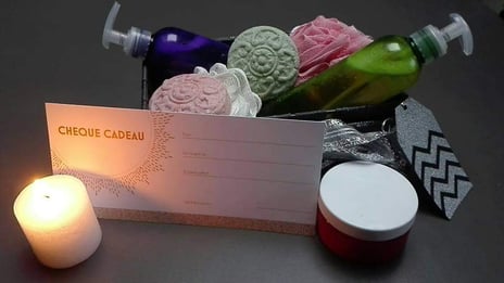 a box of soaps and candles on a table
