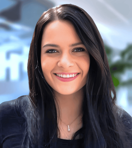 a woman with long hair and a black top