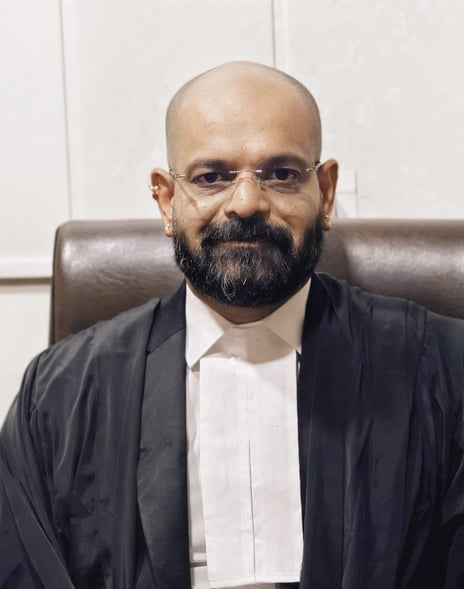 Adv. Tejas R. Patil (B.Com., LL.B.)