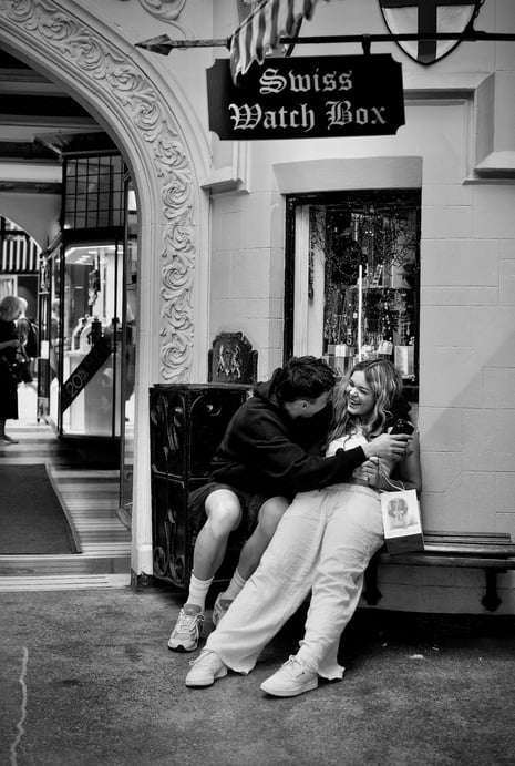 Young lovers on a bench in London Court, Perth by street photographer Peter Pickering