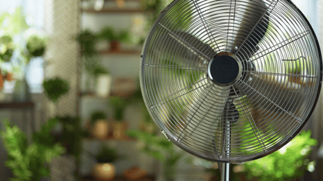a fan on a table top with a fan