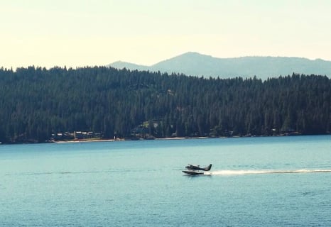 Coeur d'Alene, ID - A seaplane landing on Lake Coeur d'Alene after the aerial tour
