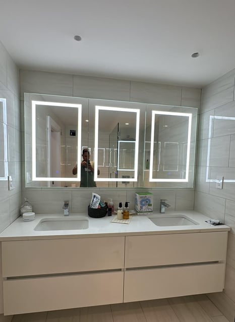 a bathroom with a mirror and a mirror