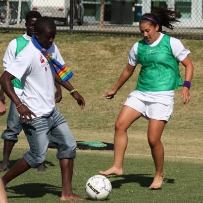Dr. Sam Van Gorder playing barefoot soccer with local students in Egypt during Semester at Sea.