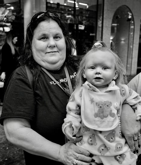 A lady with one of her adopted children - a doll! - by Peter Pickering