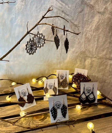 a table with custom wood earrings