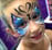 a Purple and Blue Metallic and Sparkly Butterfly Face Painting 