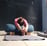 Restorative yoga pose to improve spinal flexibility with bolster and blanket as props