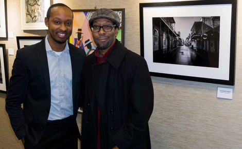 photographer Gary Washington and Will Clarke standing next to bourbon st artwork