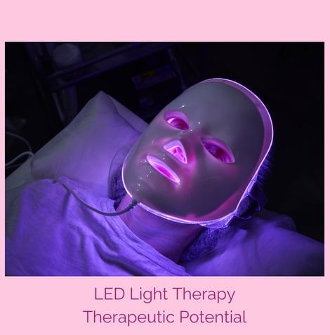 LED Light Therapy Face Mask illuminated in purplish light