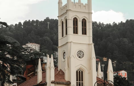 a church with a steeple and a clock tower