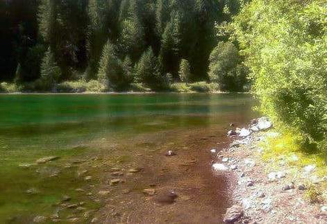 Eugene, OR - The emerald glass lake is pure tranquility at the bottom of Sahalie Falls loop trail
