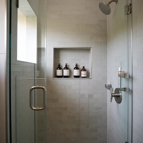 a bathroom with a shower and a shower