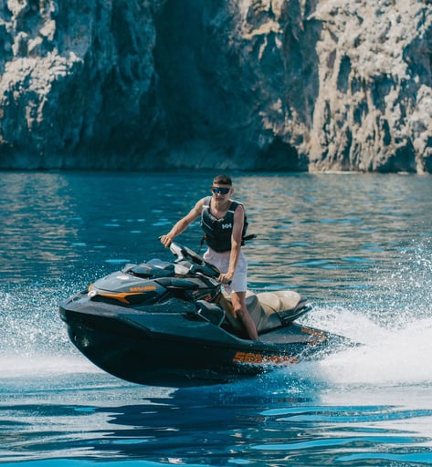 Tourist enjoying a guided jet ski tour along the Mallorca coast