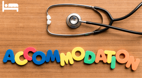 a stethoscope near a text composing of the letters of the word accommodation