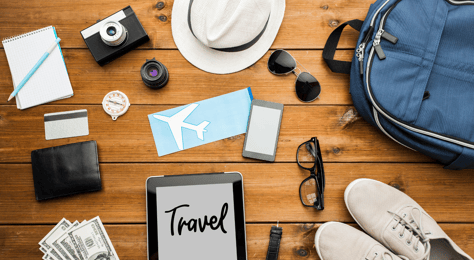 a tablet and many travel essentials