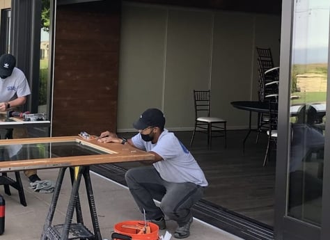 technician replacing sliding door rollers wooden sliding door roller repair 