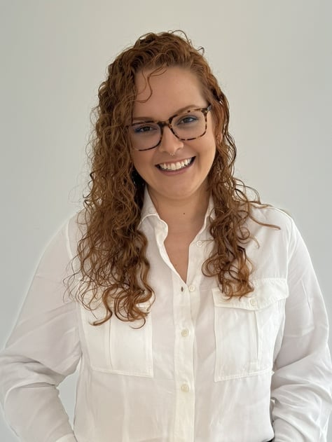 a woman in a white shirt and jeans