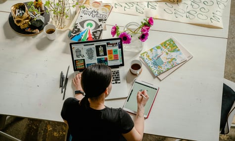 Creative businesswoman drawing digitally