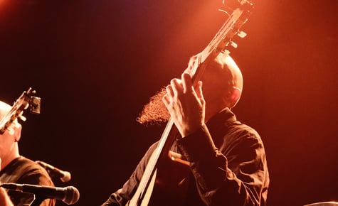 a man playing a guitar 