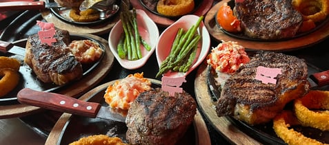a table with plates of food and a knife and fork