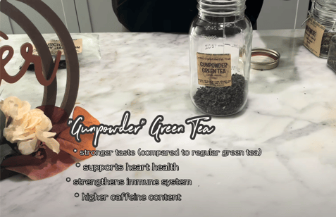 a jar of green teas and a jar of tea