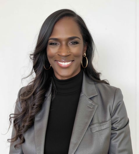 a woman in a gray suit and black top