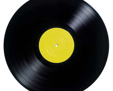 a vinyl record with a yellow label on it